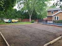 Shown here after ground prepped and with form underway for cement pour, Rhode Island backyard basketball court on concrete base in Barrington.