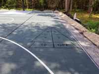 Large slate green and titanium basketball court in Easton, MA, with pickleball lines and shuffleboard.