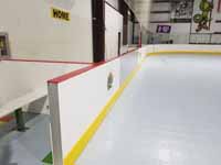 We traveled to Kapolei, Hawaii and inside to resurface two inline skate hockey rinks with Versacourt Speed Indoor tile. This is a detail view of one corner of the completed rink.