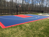 Blue and orange residential court tied into the landscape design in North Attleboro, MA.