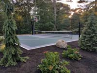MA multiple sport court for basketball plus net games like badminton, tennis, and volleyball.
