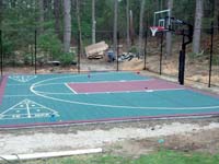Slate green and burgundy backyard basketball court in Duxbury, MA