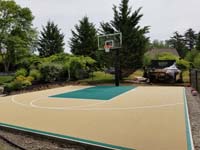 Off-white/tan and green home basketball court in Easton, MA. Dr. Seuss and basketball share Springfield, MA in common.