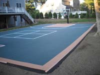 Large sport or game court surface for basketball or other games in Walpole, MA, installed on blacktop.