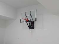 Basketball hoop installed inside a garage.
