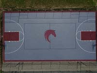 Large basketball court we resurfaced at GreatHorse Golf Club in Hampden, MA, using Versacourt Speed Outdoor Tile.