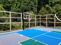 Existing grey, green and blue Versacourt to which we added new lines for pickleball and other sports besides basketball.