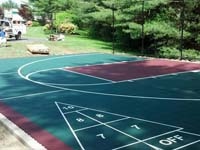 Backyard basketball court in Kingston, MA, featuring shuffleboard and tennis.