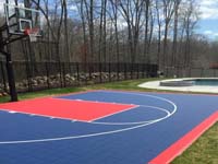 Home court for sports like basketball in North Attleboro, MA, featuring navy blue and red Versacourt game tiles.