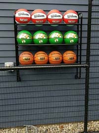 Backyard basketball court is the sort of thing you might find in Wakefield, MA or a yard like yours. Featuring closeup of basketball rack personalization by customer.