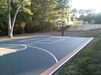 Walpole, MA backyard basketball court installed on asphalt.