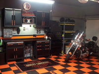 Sample picture of a workshop area installed with orange and black tile floor designed to support vehicle and equipment weights.