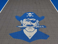 Close-up of pirate logo on home basketball court in Bedford, MA.
