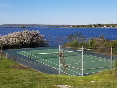 Resurfaced residential tennis court on the waterfront in Bristol, Rhode Island..