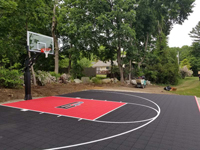 Black and red basketball court with custom graphic in Brockton, MA.