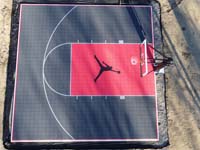 Small court, big color, catchy logo. Overhead view of black and red court in Chicopee, MA with Michael Jordan logo, but could be whatever logo you'd like on your court.