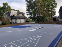Cumberland, RI backyard basketball with custom logo and shuffleboard.