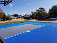 Royal blue and titanium basketball court for apartment complex residents in Dover, New Hampshire.