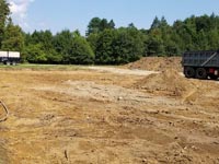 A peek at excavation and fill work associated with creating a quality, sturdy base for a long-lasting court in Easton, MA.