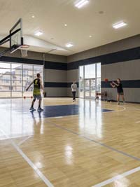 People enjoying basketball on an indoor court that's an example of SnapSports indoor surfaces in action.