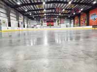 We traveled to Kapolei, Hawaii and inside to resurface two inline skate hockey rinks with Versacourt Speed Indoor tile. This is a view down the length of the first rink before construction bagan.