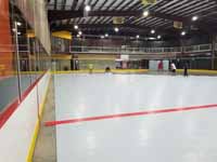 We traveled to Kapolei, Hawaii and inside to resurface two inline skate hockey rinks with Versacourt Speed Indoor tile. This shows installation of tiles in progress from another direction.