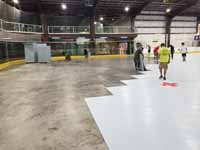 We traveled to Kapolei, Hawaii and inside to resurface two inline skate hockey rinks with Versacourt Speed Indoor tile. This shows tile installation in full swing.