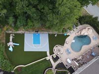 Drone view of basketball court and entire backyard landscape in Middleton, MA.