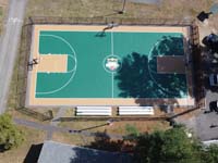 Drone view of entire new basketball court with center custom logo at Camp Wonderland in Sharon, MA.