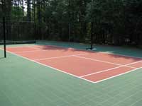 Restoration and resurfacing of large tennis court into multicourt with hopscotch and shuffleboard for a condo complex in Duxbury, Massachusetts. Focus here on the pickleball court area.