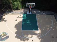 Overhead view of Westwood, MA backyard basketball court that features two custom logos.