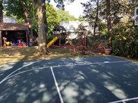 Another front view of complete home basketball court in dark and light blue in Foxboro, MA.