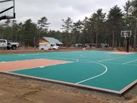 Multicourt with basketball, pickleball, shuffleboard and hoscotch as part of complete revamp of Yogi Jellystone Cranberry Campground in Cartver, MA. Containment fence and finishing landscape will come later.