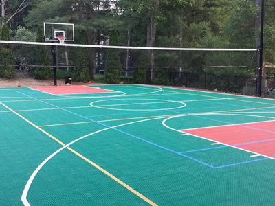 Pembroke, MA backyard multicourt with basketball and net sports including tennis, volleyball and pickleball.