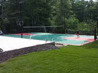 Backyard tennis and volleyball court in Pembroke, MA.