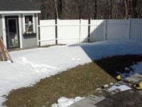 Planning started in winter, snow still on the ground, for this small black and red hingham basketball court.