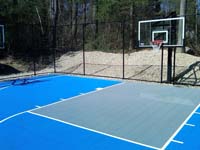 Home sport court in Lakeville, MA made with light blue and ice blue Versacourt tile colors.