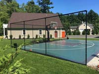 Green and graphite basketball court in Marion, MA. Distinctive appearance due to Versacourt Speed Outdoor tile used instead of the usual Game Outdoor.