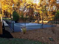 Beautiful late autumn home basketball court installation designed to fit neatly into the landscape in an undisclosed Massachusetts location. Update: It's Westford, MA.