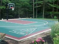 Slate and burgundy backyard basketball court in Kingston, MA.