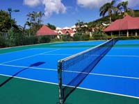 Resort tennis court in Antigua, resurfaced and old nets replaced.