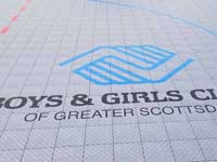 Closeup of logo for Boys & Girls Clubs of Greater Scottsdale, AZ, on inline hockey rink.