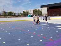 Installation of court tiles in progress on newly built inline hockey rink at Grand Canyon University in Phoenix, AZ. Logo for GCU Antelopes in foreground and Arizona Coyotes in background, especially if you click for the larger image.